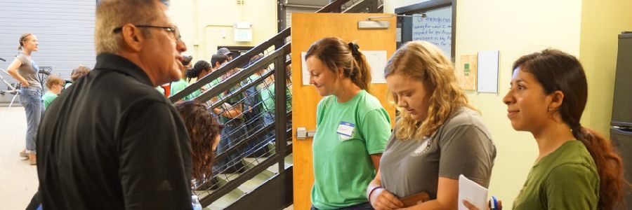 Corpsmembers speaking with a MHYC partner