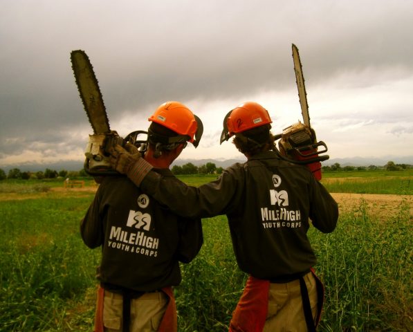 Two corposmembers with hands around shoulders.