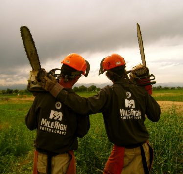 Two corposmembers with hands around shoulders.