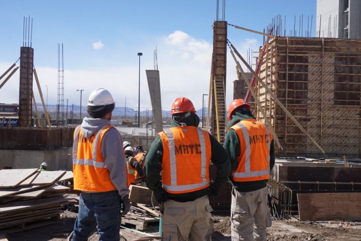 Corpsmembers at construction site of tower.