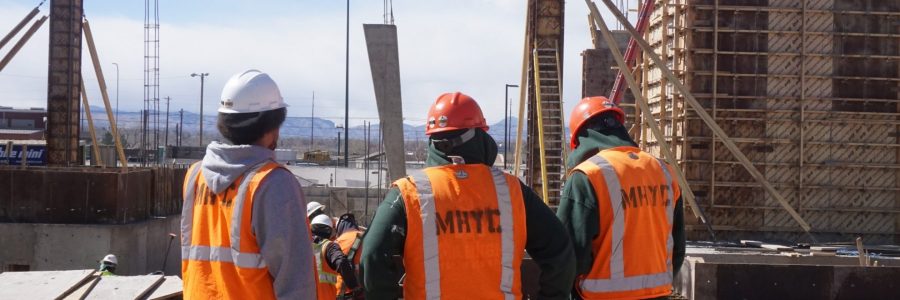 Corpsmembers at construction site of tower.
