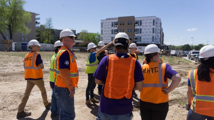 MHYC Construction crew members meeting.